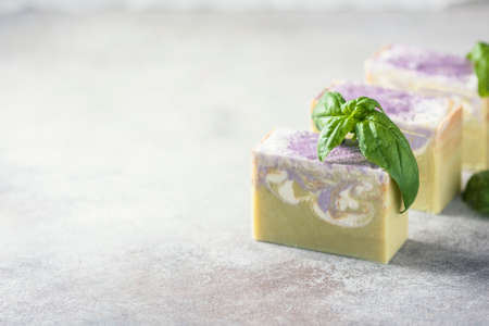 Bars of handmade soap with basil, the concept of spa and health.の写真素材