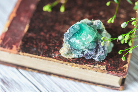 Old book and mineral stones crystals. Crystal Ritual, Healing Crystals. Natural gemstones. Gemstones...