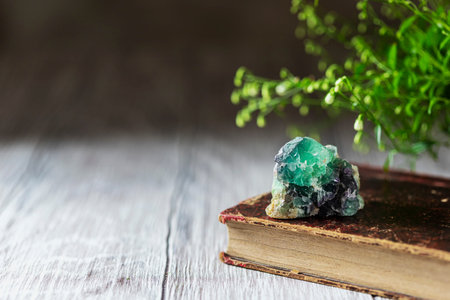 Old book and mineral stones crystals. Crystal Ritual, Healing Crystals. Natural gemstones. Gemstones...