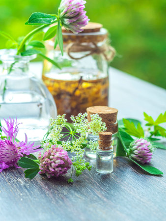 Herbs, bottles on wooden background. Alternative Medicine, Natural Healing. Selective focus