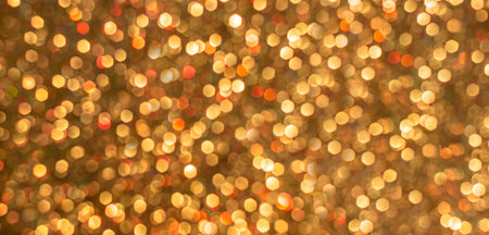 Gold bokeh holiday textured glitter background. Blurred abstract holiday background. Sparkling...