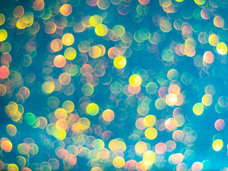 Blue bokeh holiday textured glitter background. Blurred abstract holiday background. Sparkling...