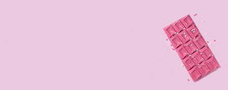 Handmade trendy pink or ruby chocolate. Selective focus. Banner