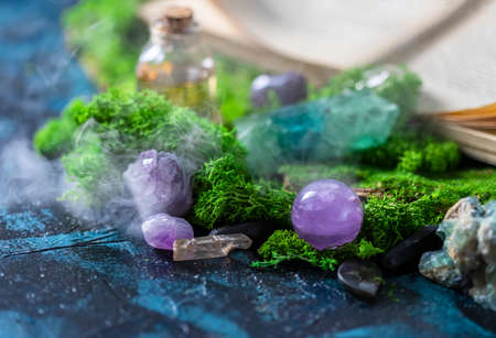 Crystalline minerals for meditation, moss, book. Magic Rock for Healing stones. Minerals for relaxation. Copy spaceの写真素材