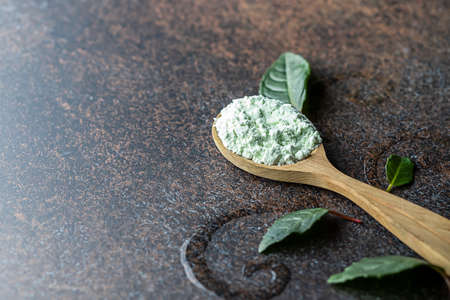 Collagen powder on a dark background. Natural supplement for skin beauty and health. Plant collagen. Anti age concept.の写真素材