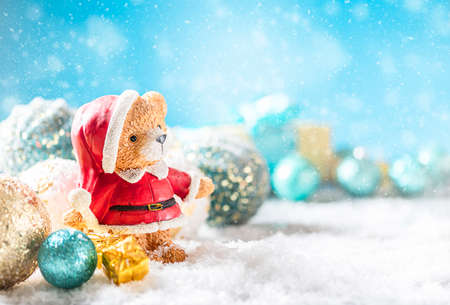 Christmas festive background. Santa teddy bear and Christmas decoration in snow. Xmas and Happy New Year theme. Copy spaceの写真素材