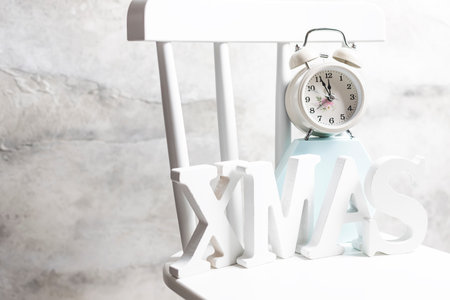 White deer on a white chair. New year concept. Selective focus, copy space