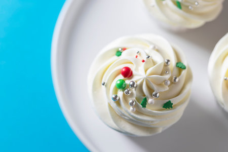 Homemade christmas cupcakes with different decorations. New year food concept. Selective focus