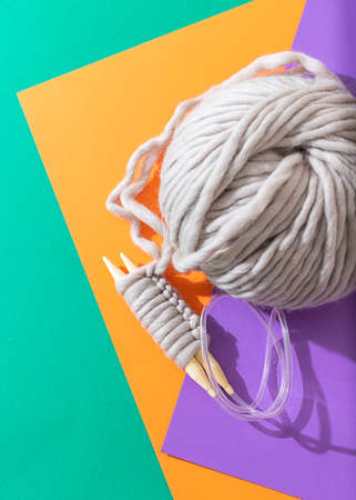 Close-up of knitting wooden knitting needles. Zero waste concept. Hobby, cozy homely weekend and hugge concept. Copy spaceの写真素材