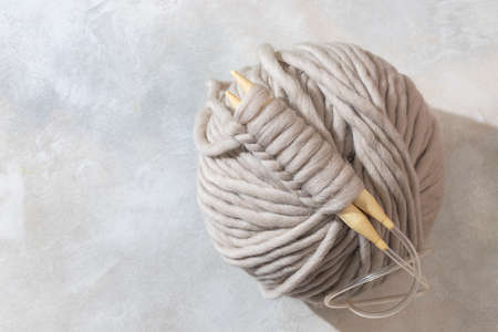 Close-up of knitting wooden knitting needles. Zero waste concept. Hobby, cozy homely weekend and hugge concept. Copy spaceの写真素材