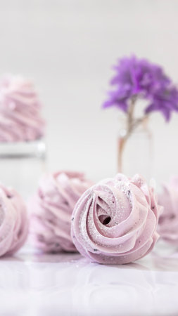 Handmade marshmallow with blueberries, white background. Violet Marshmallow, Meringue, Zephyr Selective focusの写真素材