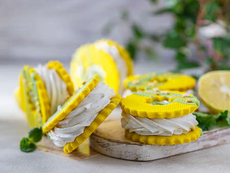 Marshmallow sandwich. Sable sugar cookies with lemon, mint marshmallows, zefir. Close-up shot, selective focusの写真素材