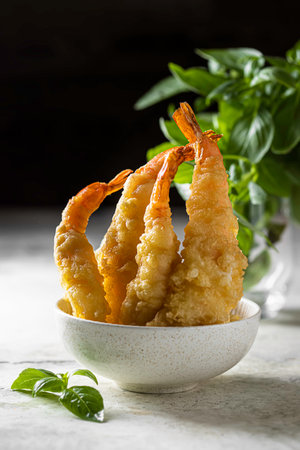 Delicious shrimp tempura on light gray concrete background. Breaded prawns. Selective focusの写真素材