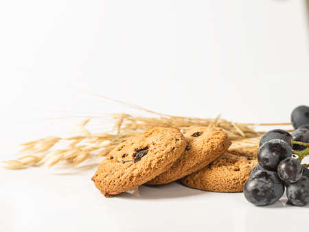 Oatmeal raisin cookies on white background. Healthy Food Snack Concept. Selective focus, copy spaceの写真素材