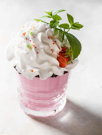 Cold strawberry milkshake, with fresh strawberries and cream. Healthy food for breakfast and snack. Selective focusの写真素材