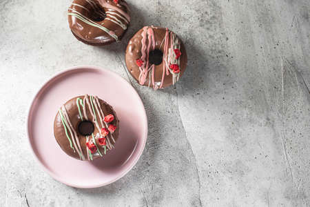 Homemade Chocolate Donuts with chocolate coating. National Donut Day. Homemade baking. Selective focus, copy spaceの写真素材
