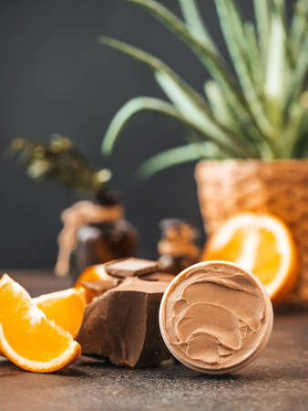 Chocolate face and body butter cream. Homemade spa cosmetic recipe. DIY cosmetics. Spa treatments. Selective focusの写真素材