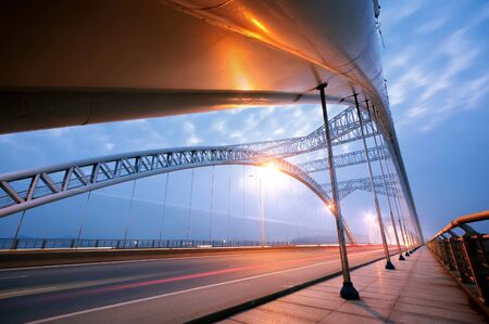 Bridge at night, brightly lit.の写真素材