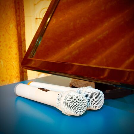 On display next to a pair of microphones, a strong color contrastの写真素材