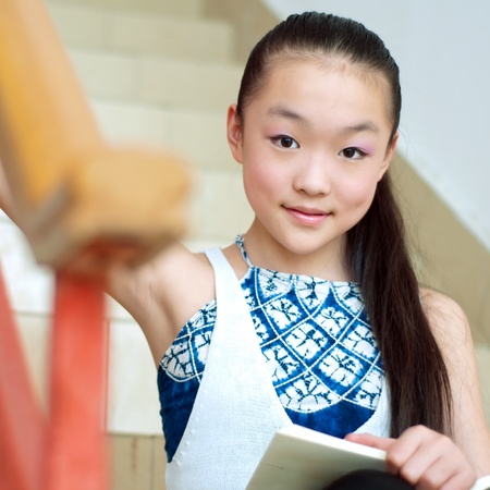 Pretty girls reading in the library, very serious study.の写真素材