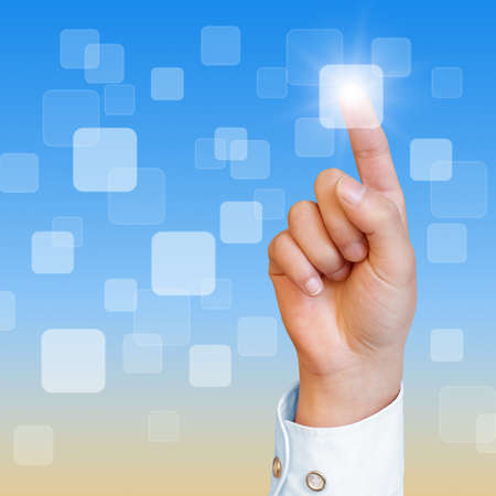 hand pushing a button on a touch screen interfaceの写真素材