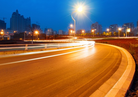 beautiful light trail at the busy highwayの写真素材
