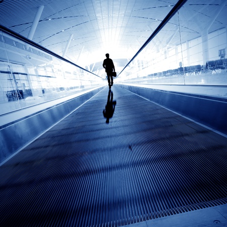 Blue moving escalator in the office hall perspective viewの写真素材