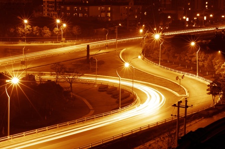 beautiful light trail at the busy highwayの写真素材