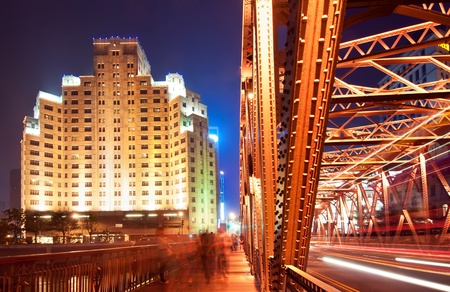 A historic bridge at Shanghai bund nightの写真素材