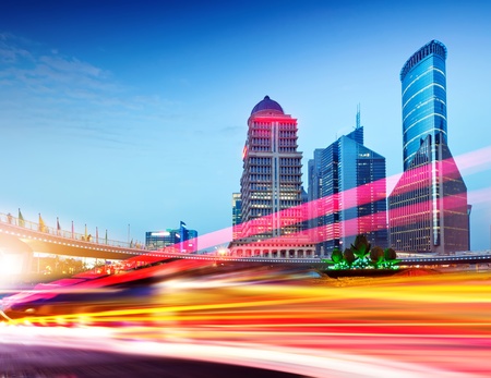 the light trails on the modern building background in shanghai china.の写真素材