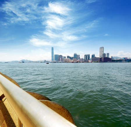 A Hong Kong harbour, at a lot of ships and is surrounded by skyscrapers.
の写真素材