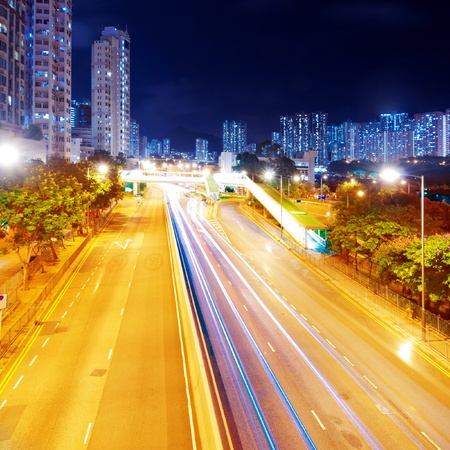 The light trails on the modern building background in Hong Kong china.の写真素材