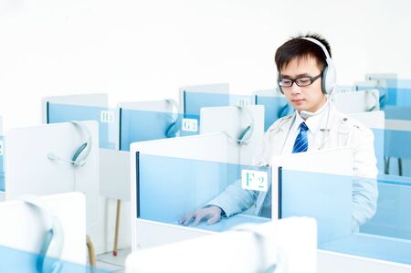 Language lab, a man wearing headphones の写真素材