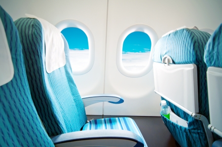 Empty aircraft seats and windows.の写真素材