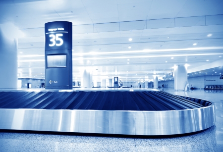 Single suitcase alone on airport carouselのeditorial素材