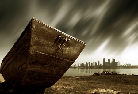 The other side of the city, abandoned wooden boat, urban fantasy landscape, exaggerated performance.の写真素材