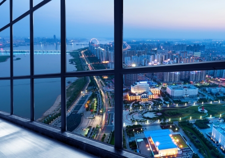 Out of the window of the big city at nightの写真素材