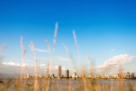 Urban Landscape,Blue sky and white clouds, a river city.