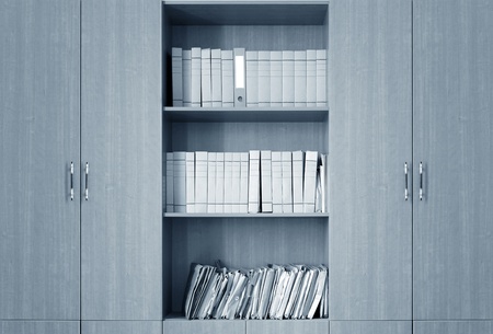 file folders, standing on the shelves in the backgroundの写真素材