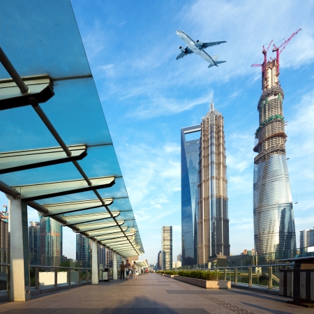 Shanghai's skyscrapers and airplanes on skyのeditorial素材