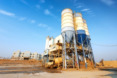 Small cement factory under blue skyのeditorial素材