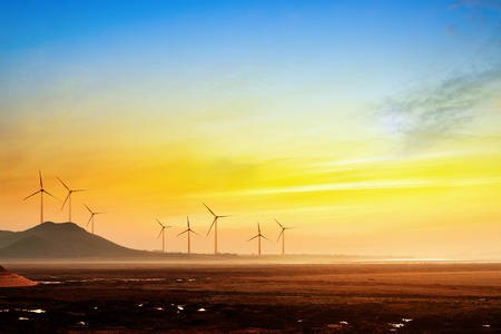 Stretch as far as eye can see the grass and the horizon distance, wind turbine.の写真素材