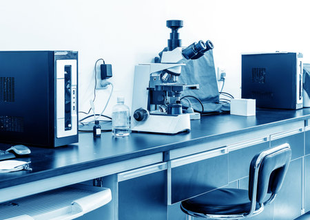 Microscope isolated against white background