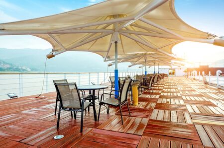 Cruise ship deck, morning sun shines on the floor, a piece of red.のeditorial素材