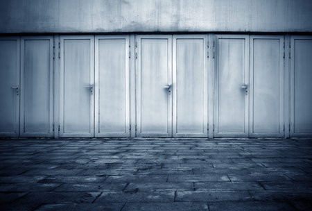 Abandoned garage and floor tiles, blue tones.の写真素材