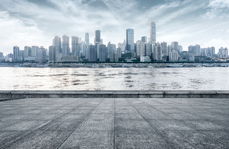 empty marble floor with cityscape and skyline in cloud skyの写真素材