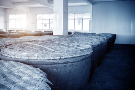 Jugs of distilled rice liquor at Sanbai Wine Workshop in Wuzhen historic scenic town.のeditorial素材