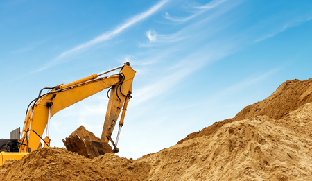 Construction sites, excavators and large amounts of dirt are being worked.の写真素材