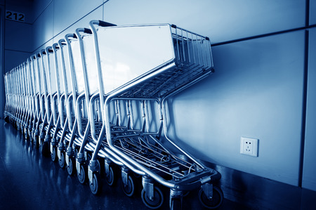 Luggage carts inside modern international airportの写真素材