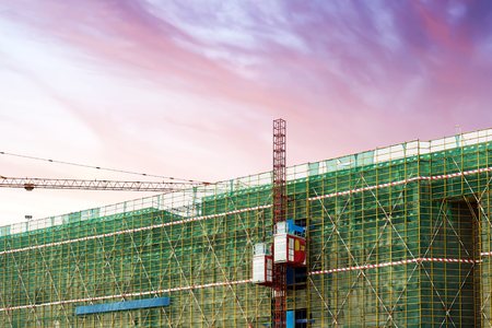 Housing construction sites, working lifts and cranes.のeditorial素材